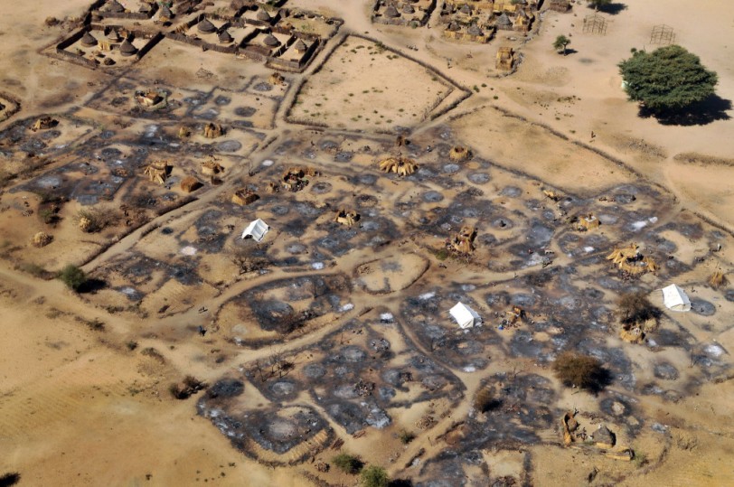 An overhead view of the remains of the burned-out village of Abu Sourouj, which was bombed on the 8 February by the Sudanese government and simultaneously attacked by armed men on camels, horseback and donkeys, otherwise known as Janjaweed, in West Darfur, Sudan, February 28, 2008. The government spate of bombings was in response to an ambush two months prior by rebels from the Justice and Equality Movement, and subsequent intelligence that JEM members were living in these villages and using them as a base. After a period of relative quiet, there has been a great deal of renewed fighting between the Sudanese government with militias loyal to the government and rebel factions, namely JEM. Dozens of civilians in Silean, Sirba, and Abu Sourouj were killed in the attacks around February 8-9th,many others were injured, and a large percentage of each of the three villages was burned to the ground. (Credit: Lynsey Addario for The New York Times)